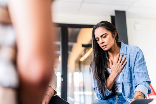 hidden cause of costochondritis, treatments, and perspectives. lady holding her chest in pain