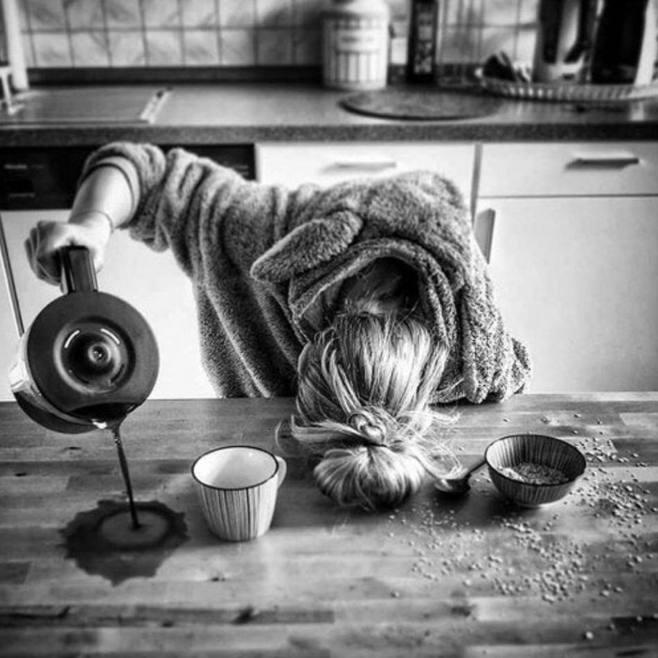 woman pouring coffee on table as side effects of sleep deprivation