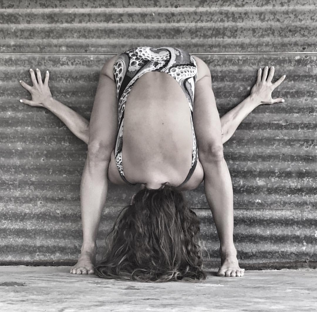 womone bending over with amazing hip mobility