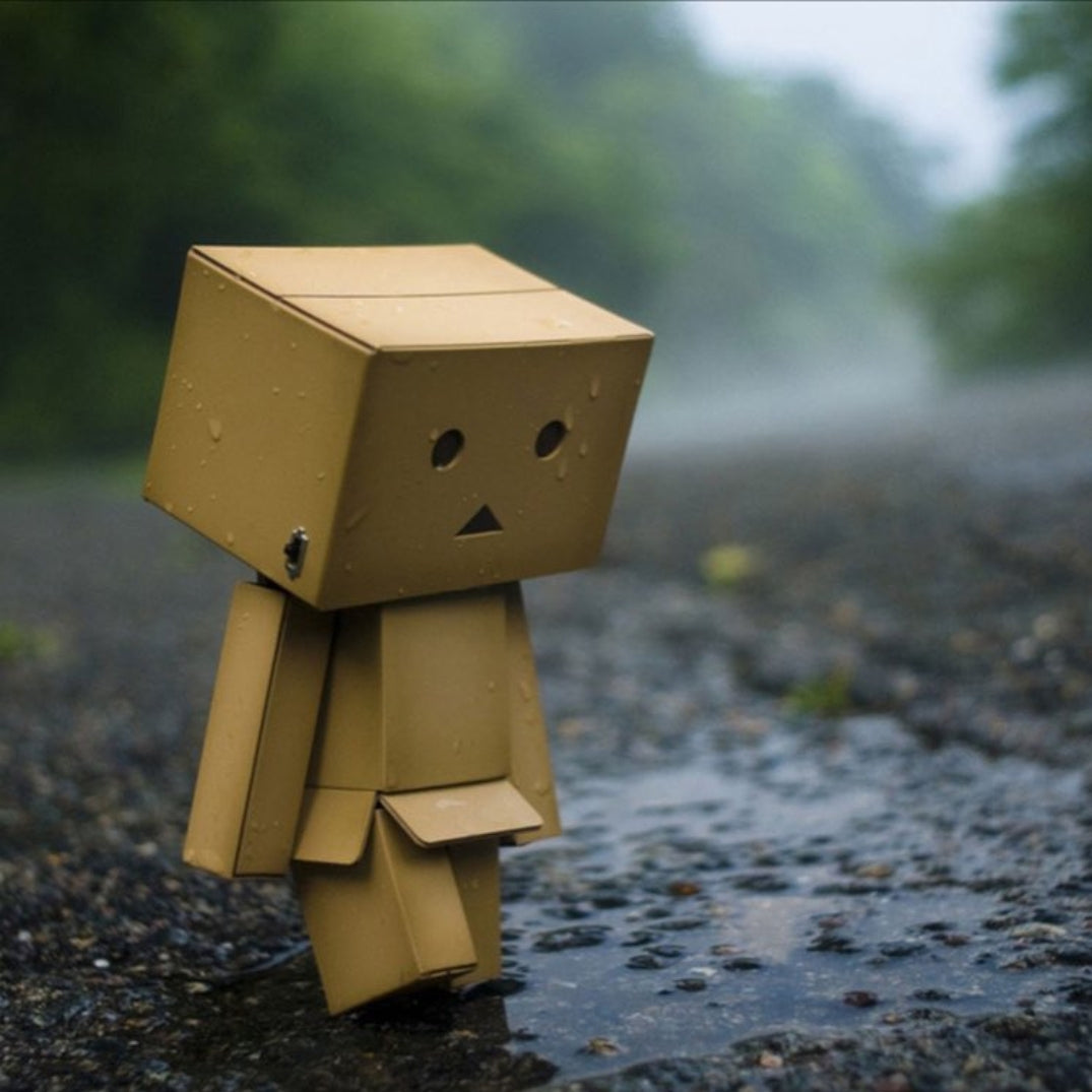 box person looking sad in rain similar to person with fibromyalgia