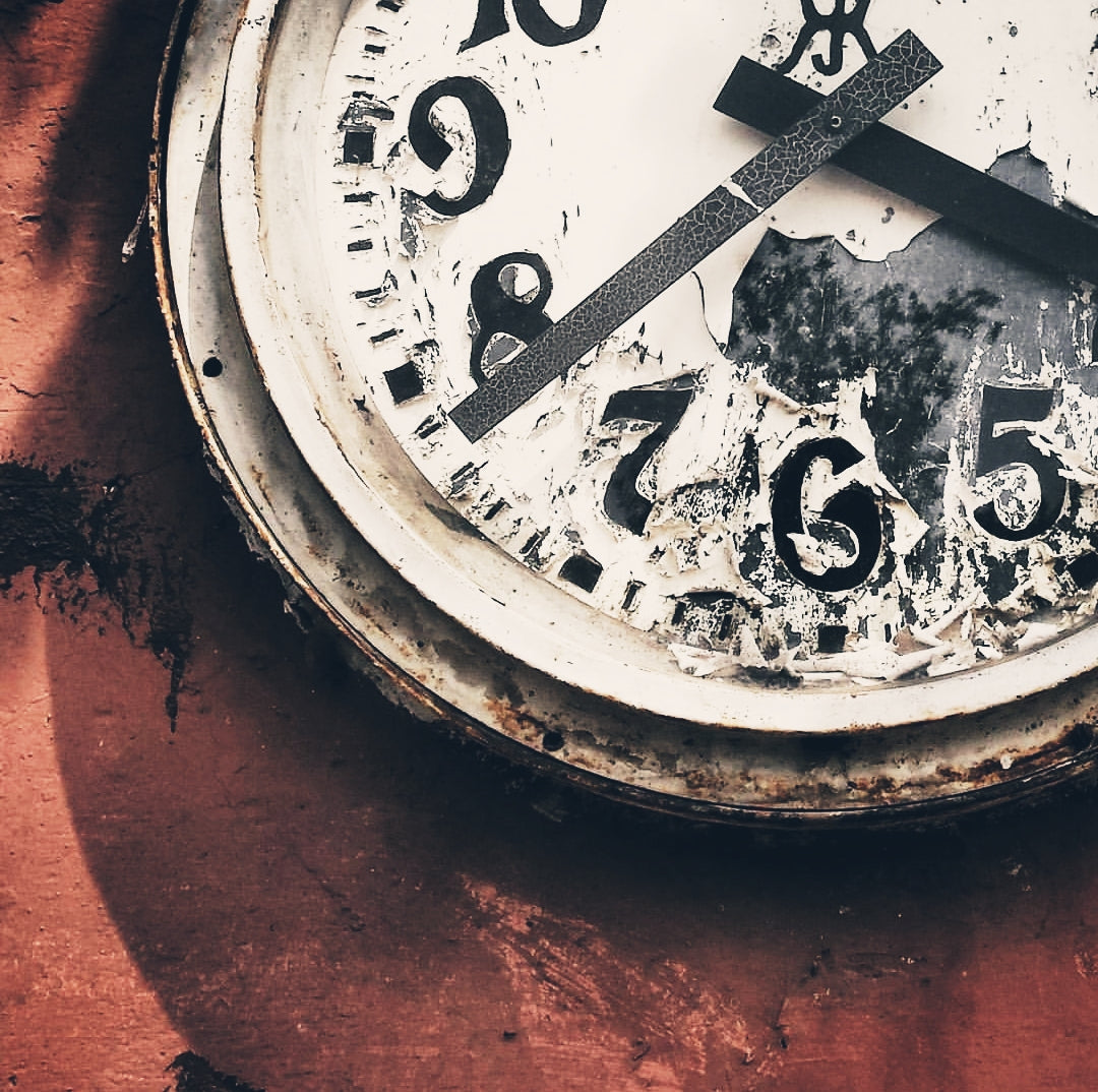 rusty old clock symbolizing the aging process