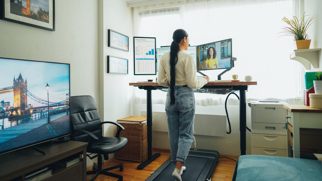 woman using a standing desk to prevent pain and injury