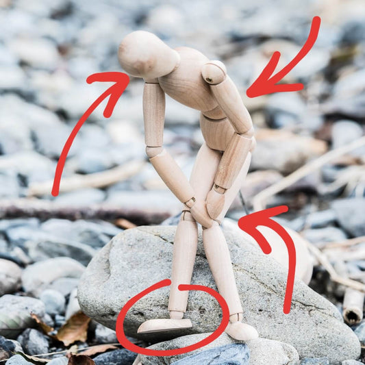 physical therapy tips wooden doll sitting in poor posture